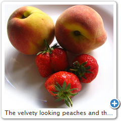 The velvety looking peaches and the shiny strawberries.