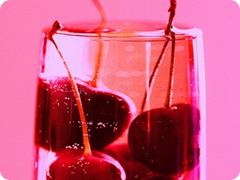 Pink Cherries in Glass of Chardonnay